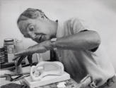 c.1960. Henry Moore with Maquette for Reclining Mother and Child (LH 480)
photo: Felix H. Man