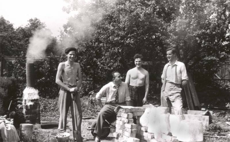 Alan Ingham, an unidentified visitor, Anthony Caro and Oliffe Richmond during a pause from foun…