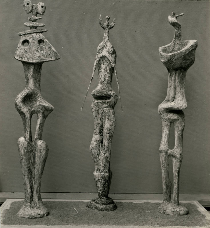 Three Standing Figures