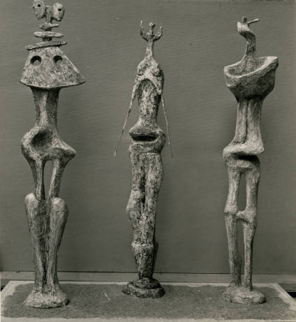 Three Standing Figures